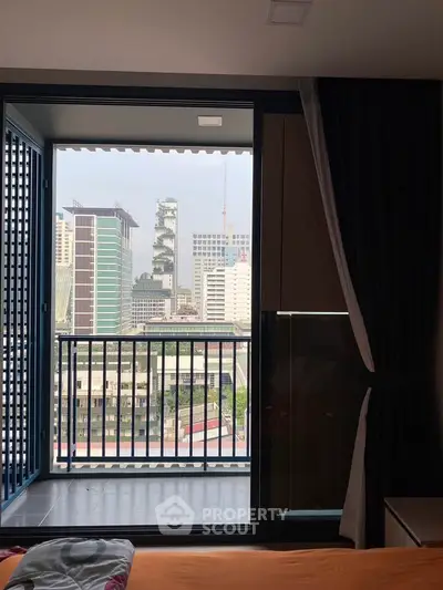 Stunning city view from modern apartment balcony with sleek design.