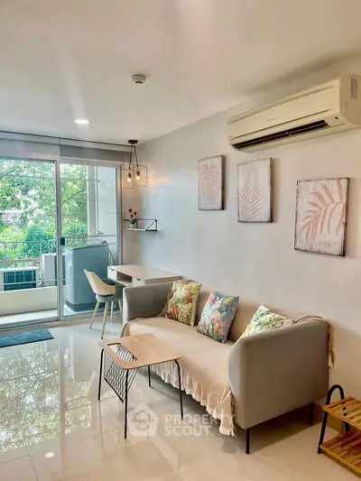 Stylish living room with modern decor and balcony view