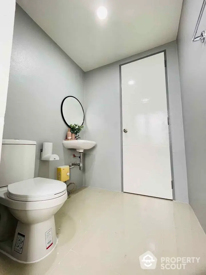 Modern minimalist bathroom with sleek fixtures and neutral tones