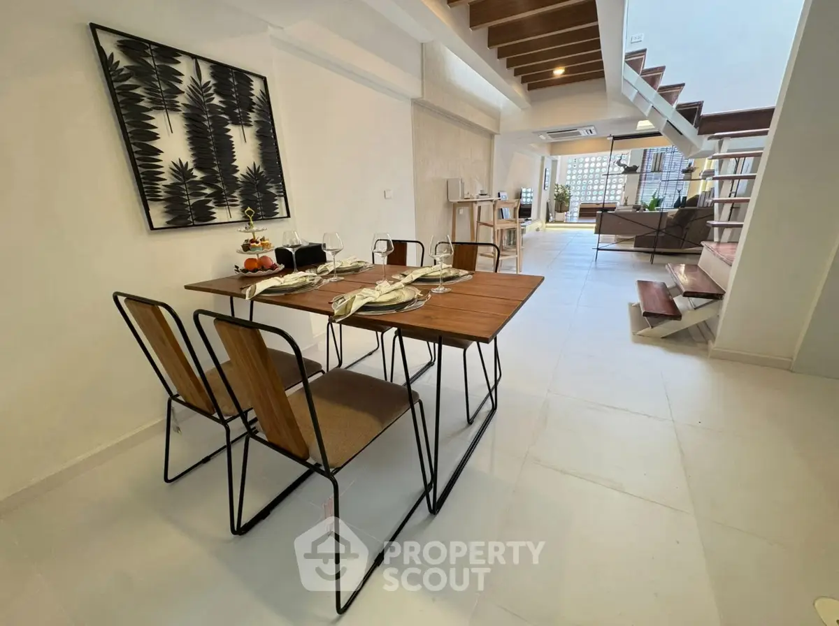 Modern dining area with stylish decor and open layout in a contemporary home.