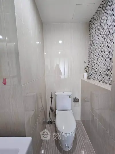 Modern bathroom with sleek design and stylish tile accents
