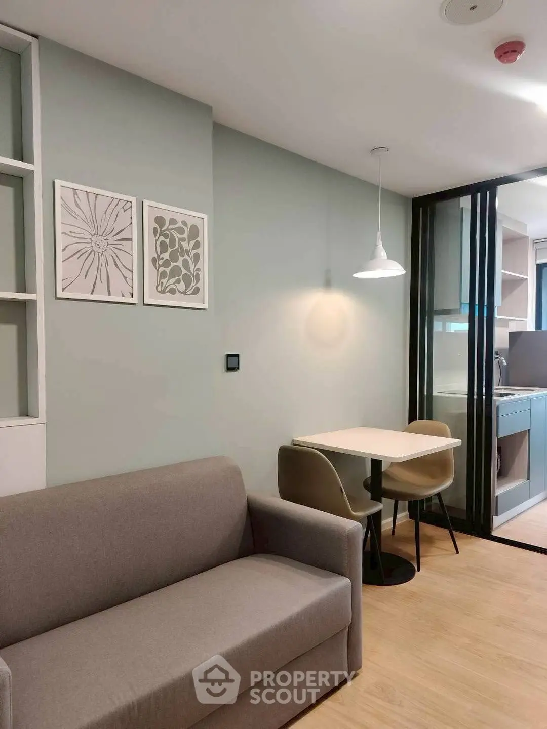 Modern living room with cozy sofa and dining area in stylish apartment