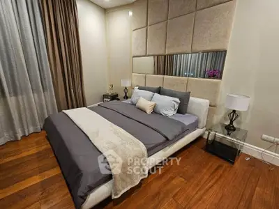 Luxurious bedroom with elegant decor and plush bedding in modern apartment