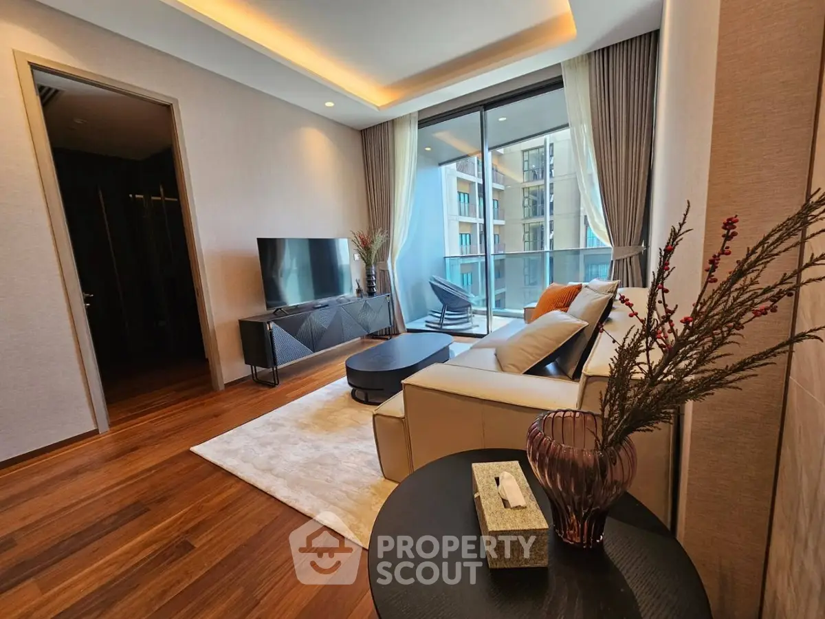 Luxurious modern living room with elegant decor and large balcony view.