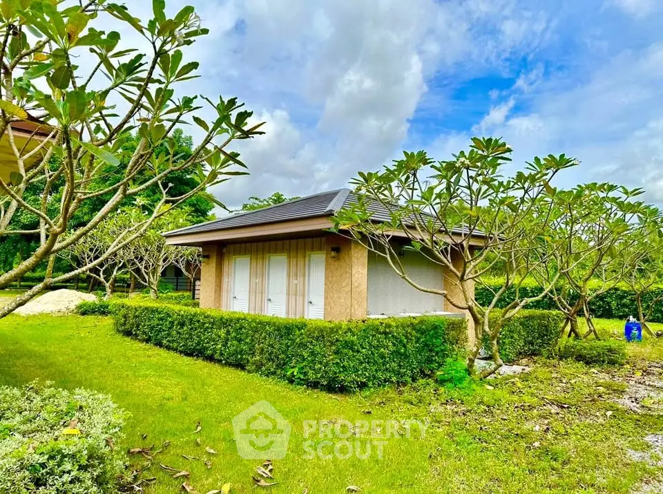 Charming garden view of a cozy single-story home with lush greenery.
