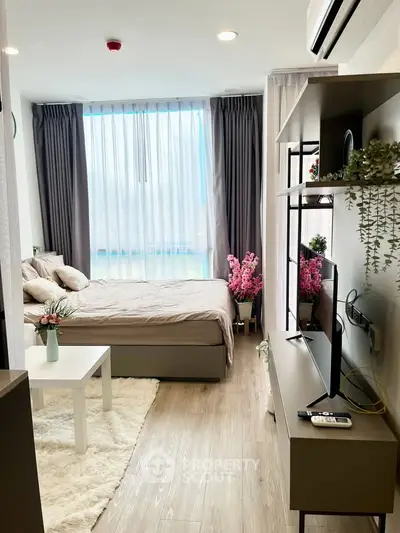 Modern studio apartment with cozy bedroom and stylish decor