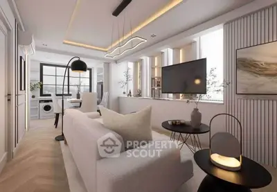 Modern living room with stylish decor and open layout, featuring a cozy sofa and sleek TV setup.