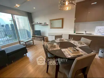 Modern living room with dining area and city view in luxury apartment