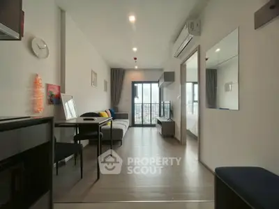 Modern open-plan living room with balcony in a stylish apartment