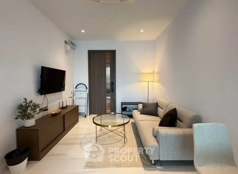 Modern living room with sleek furniture and stylish decor, perfect for urban living.