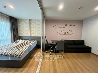 Modern bedroom with stylish decor and cozy workspace