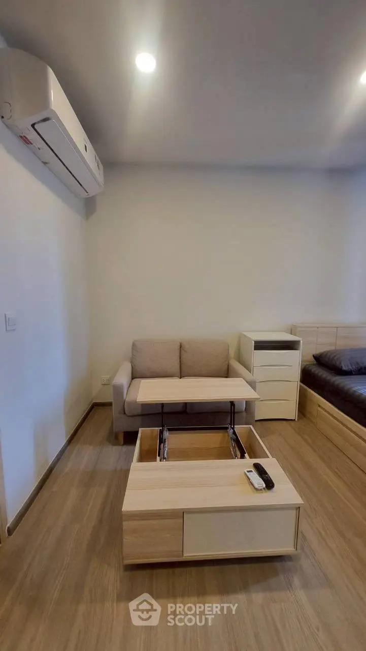 Modern studio apartment with multifunctional furniture and sleek design