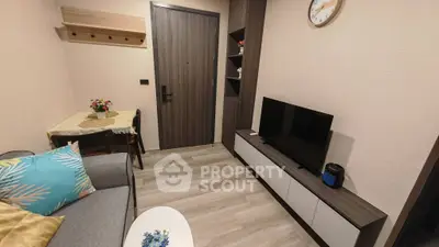 Cozy living room with modern decor and entertainment setup, perfect for relaxation and leisure.