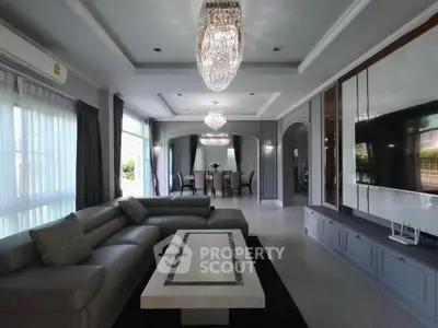 Luxurious living room with elegant chandelier and modern decor