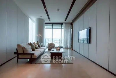 Luxurious modern living room with floor-to-ceiling windows and elegant decor.