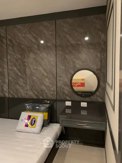 Modern bedroom with sleek design and built-in vanity mirror