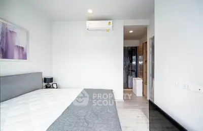 Modern bedroom with air conditioning and minimalist decor