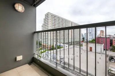 Modern balcony with city view in high-rise apartment