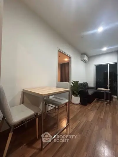 Modern living room with sleek furniture and wooden flooring