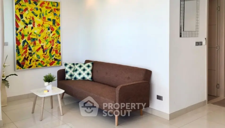 Modern living room with stylish sofa and vibrant artwork