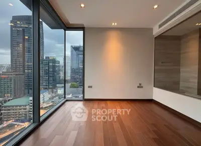 Modern high-rise apartment with stunning city view and hardwood floors