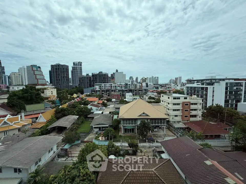 Stunning cityscape view showcasing diverse architecture and lush greenery, perfect for urban living enthusiasts.