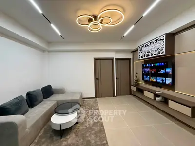 Modern living room with stylish lighting and sleek entertainment center