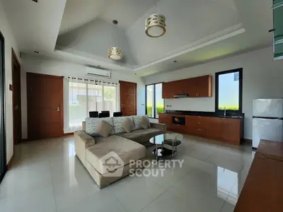 Spacious modern living room with high ceilings and elegant furnishings