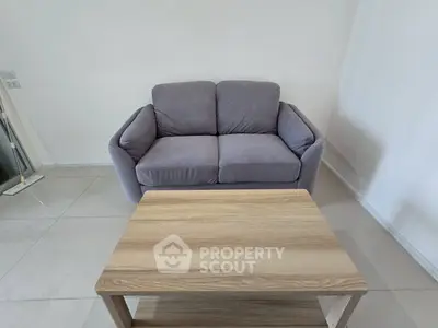 Cozy living room with modern gray sofa and wooden coffee table