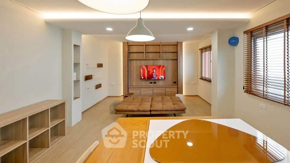 Modern living room with stylish wooden decor and cozy seating area