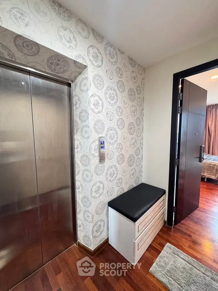 Stylish apartment entrance with modern elevator and chic decor