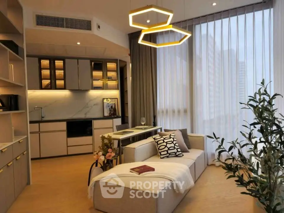 Modern living room with open kitchen, stylish lighting, and floor-to-ceiling windows in a chic apartment.