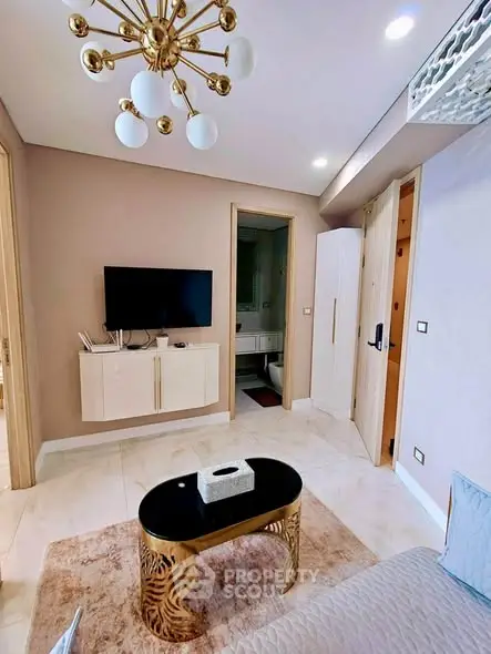 Elegant living room with modern decor and stylish lighting in a contemporary apartment.