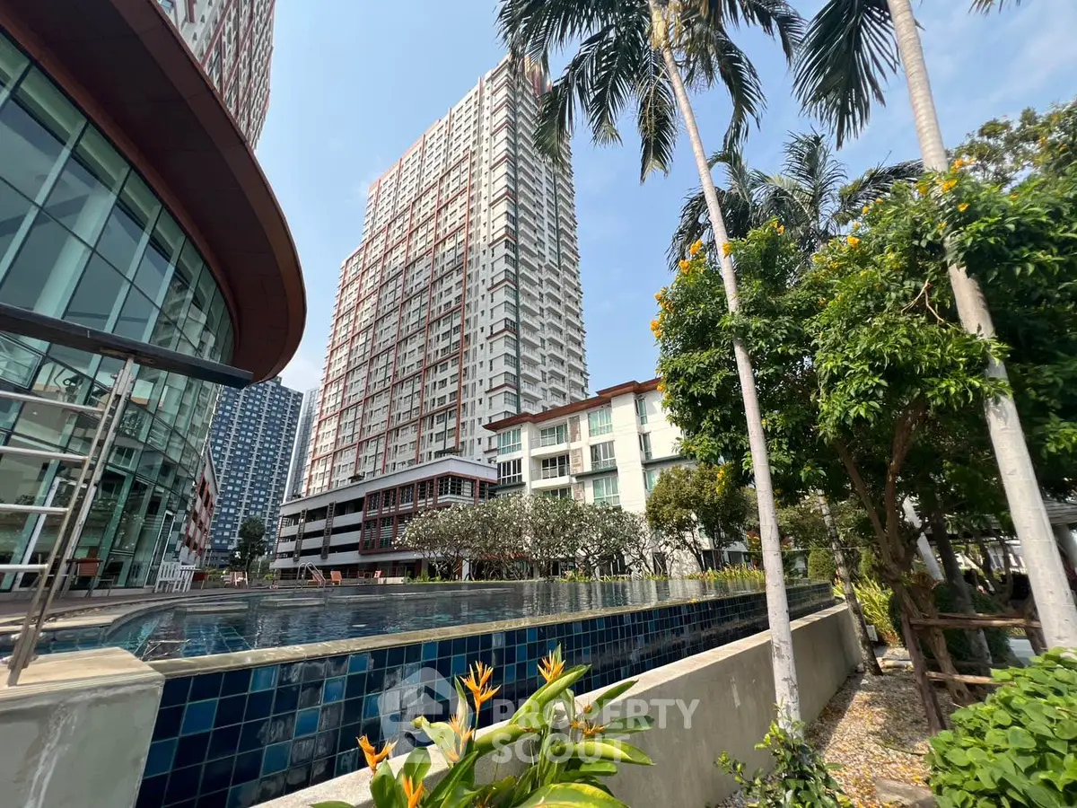 Stunning urban high-rise with lush greenery and poolside view
