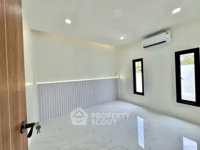Modern minimalist room with marble flooring and air conditioning, perfect for a stylish living space.