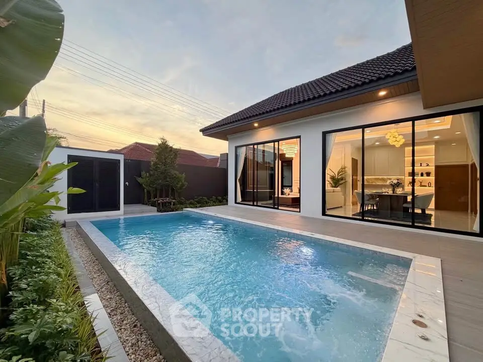 Luxurious modern home with private pool and elegant interior design, perfect for serene living.