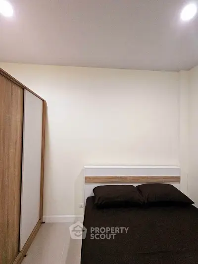 Cozy bedroom with modern wardrobe and minimalist design