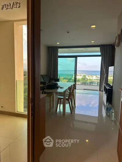 Spacious living room with stunning balcony view in modern apartment