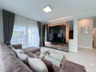 Spacious modern living room with elegant decor and large windows