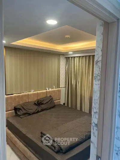 Luxurious bedroom with modern lighting and elegant curtains