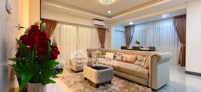 Luxurious living room with elegant decor and plush seating in modern apartment