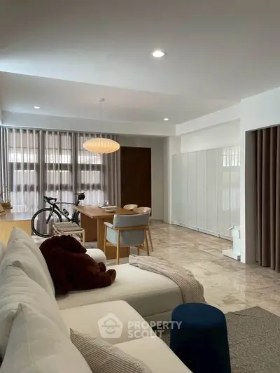 Spacious modern living room with elegant decor and natural light