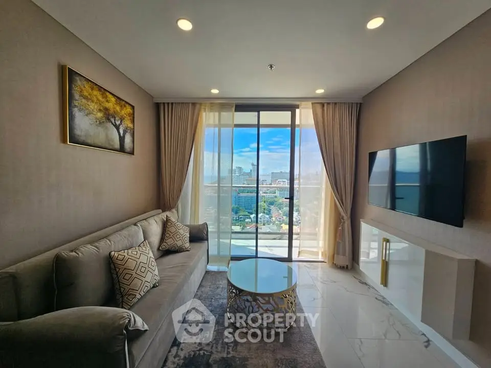 Luxurious living room with stunning city view, elegant decor, and modern furnishings.