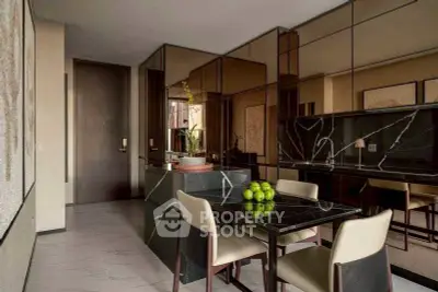 Luxurious modern kitchen with sleek black marble countertops and elegant dining area.