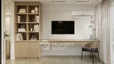Modern study room with built-in shelving, sleek desk, and wall-mounted TV in a minimalist design.