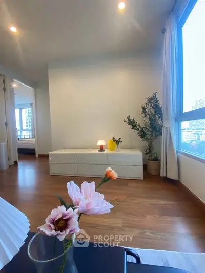 Bright and airy living room with large window and modern decor