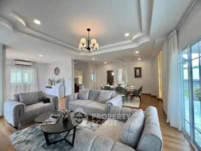 Spacious modern living room with elegant decor and open dining area