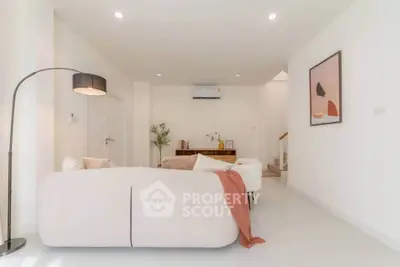 Spacious modern living room with elegant decor and cozy seating area, perfect for relaxation and entertaining.