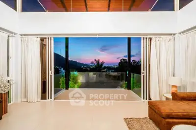 Luxurious living room with stunning sunset view and spacious balcony access.