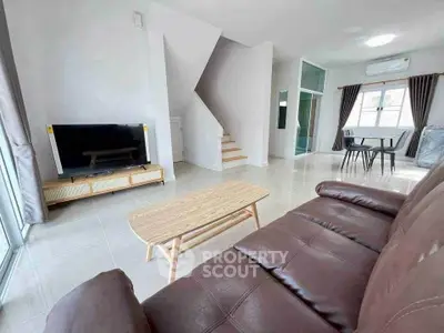 Spacious modern living room with sleek furniture and natural light